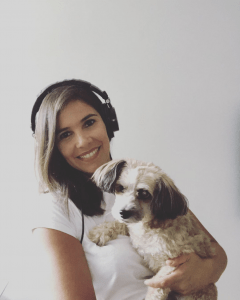 DJ Nicole Otero holding her puppy Willie