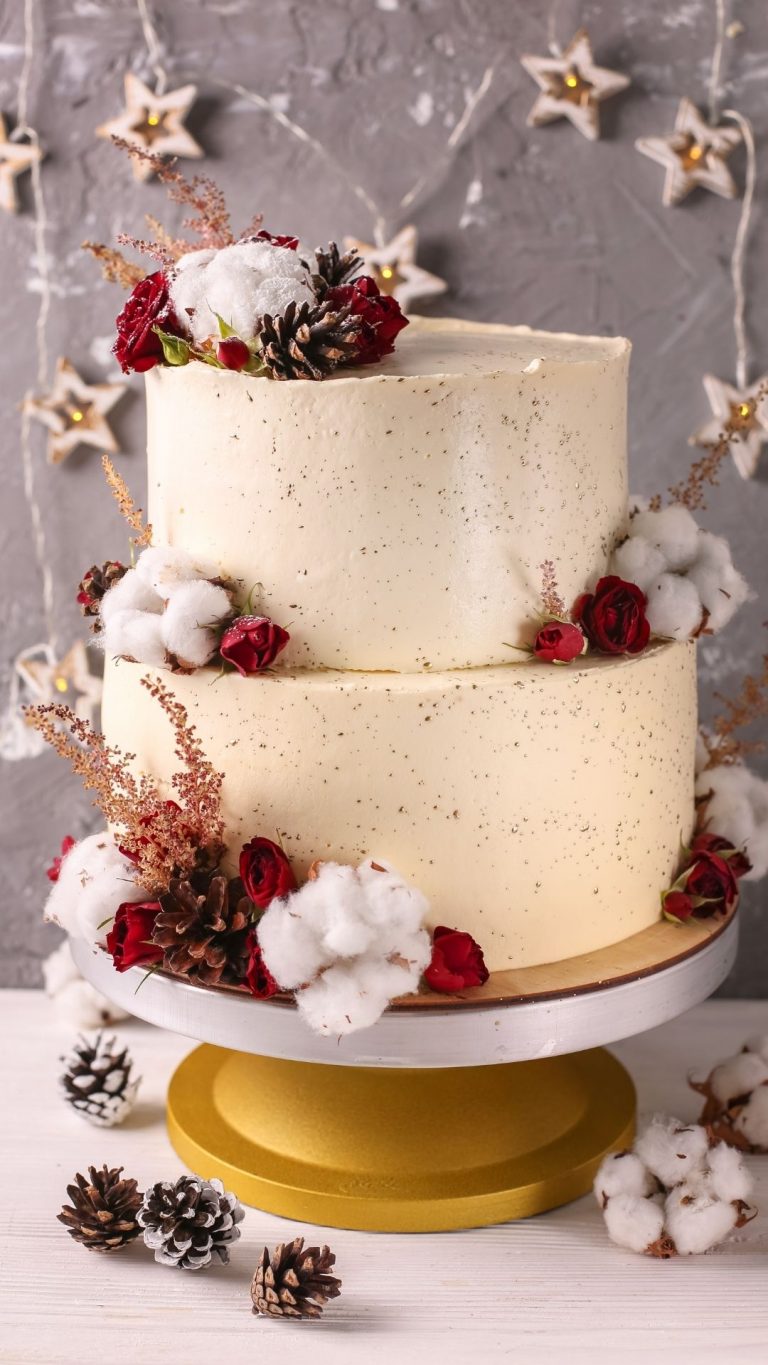 White wedding cake with pine cones