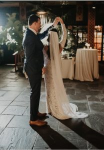 groom twirling his wife during their first dance song at their wedding