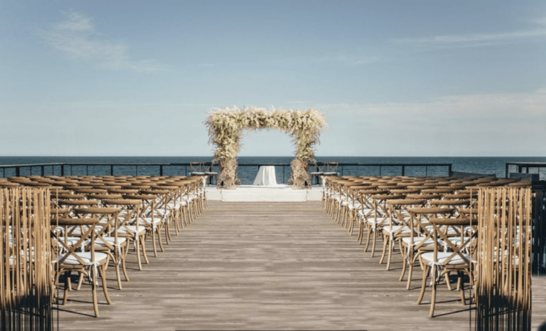 ceremony view on the dock with ocean in the background
