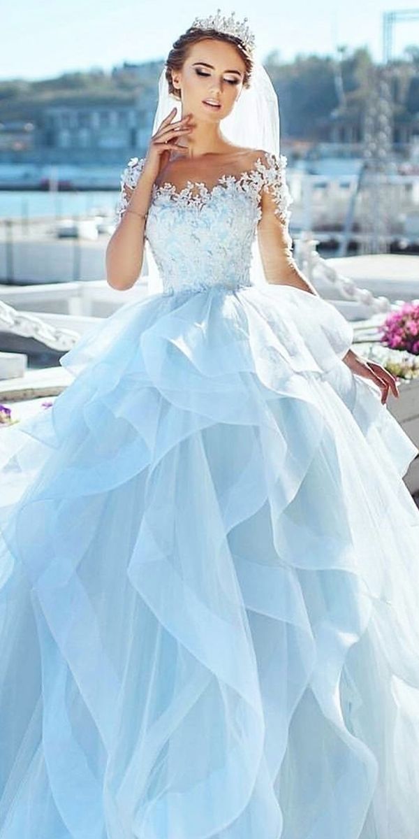 Girl in tiara wearing light blue wedding dress