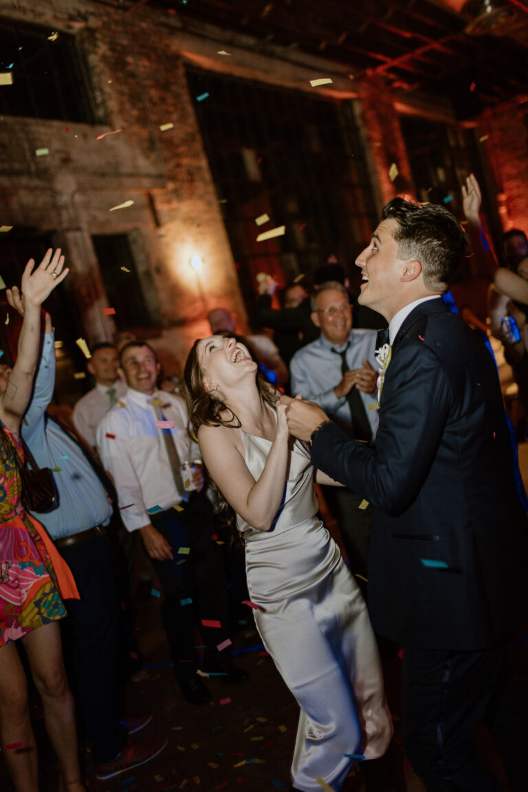 Mike and Jessica dancing with confetti falling around them